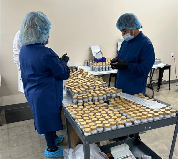 Manufacturing team inspecting Haro Clear bottles at the Oklahoma City facility